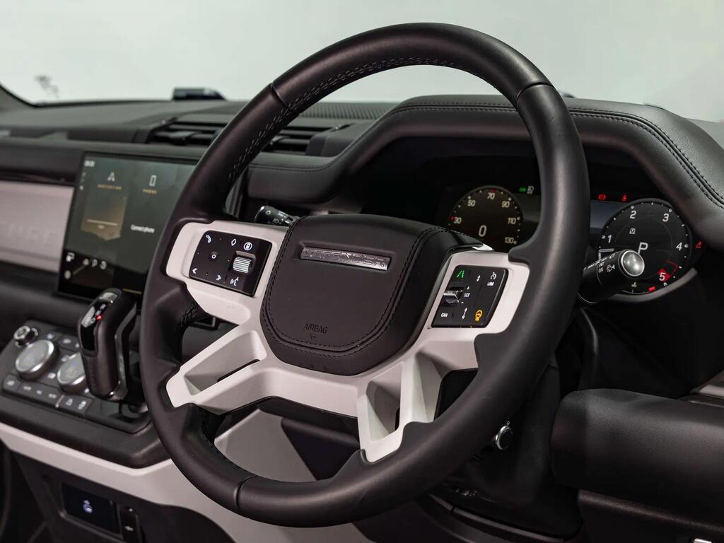 An interior shot of the steering wheel on a 2024 Land Rover Defender 110