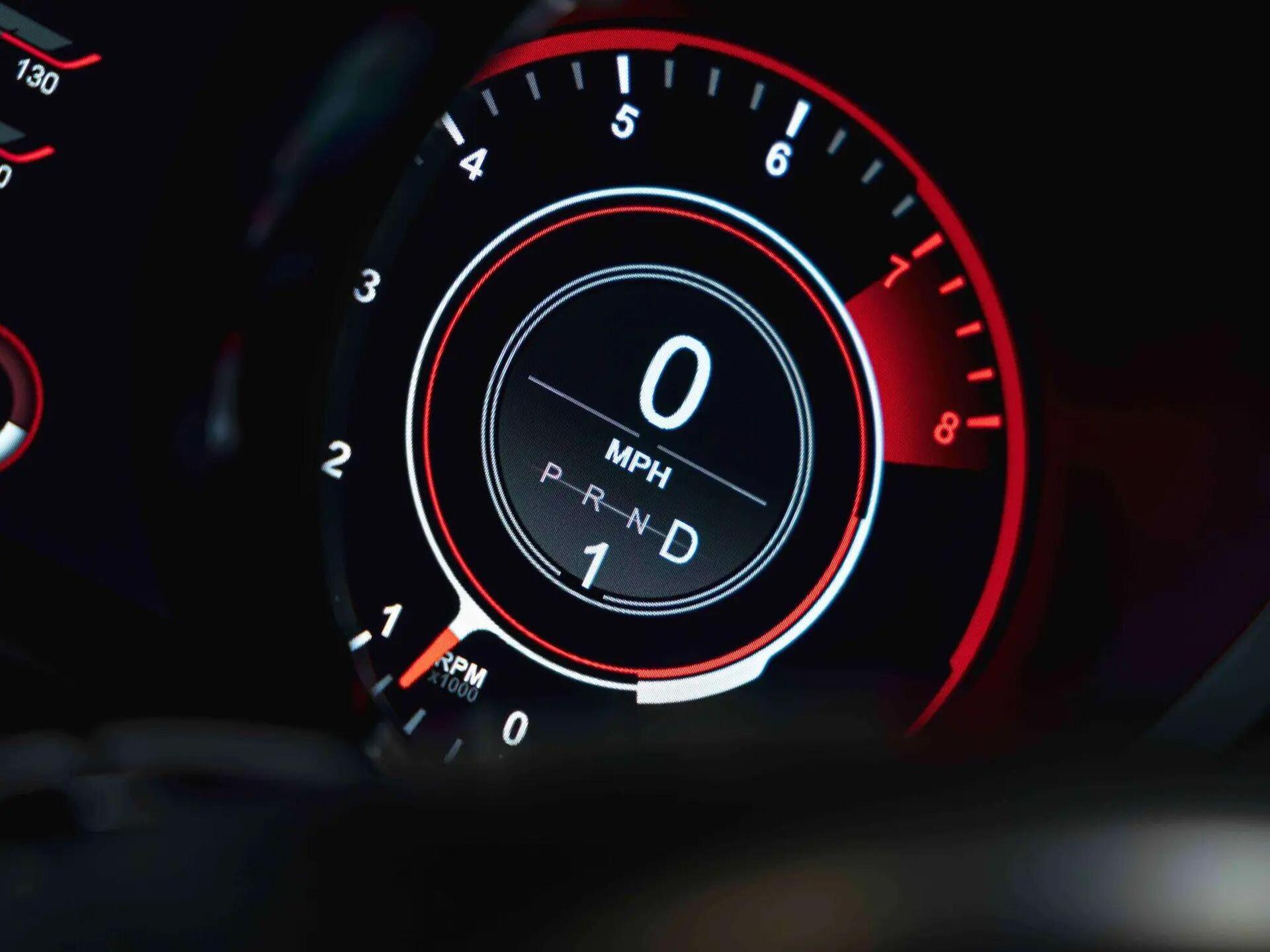 An interior shot of the driver instruments on a 2019 Aston Martin DBS