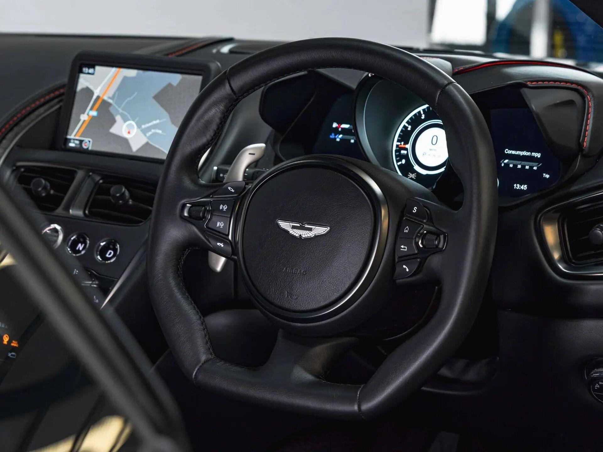 An interior shot of the steering wheel on a 2019 Aston Martin DBS