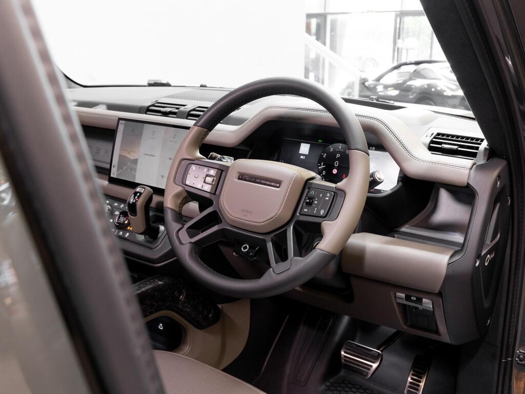An interior shot of the steering wheel on a 2025 Land Rover DEFENDER