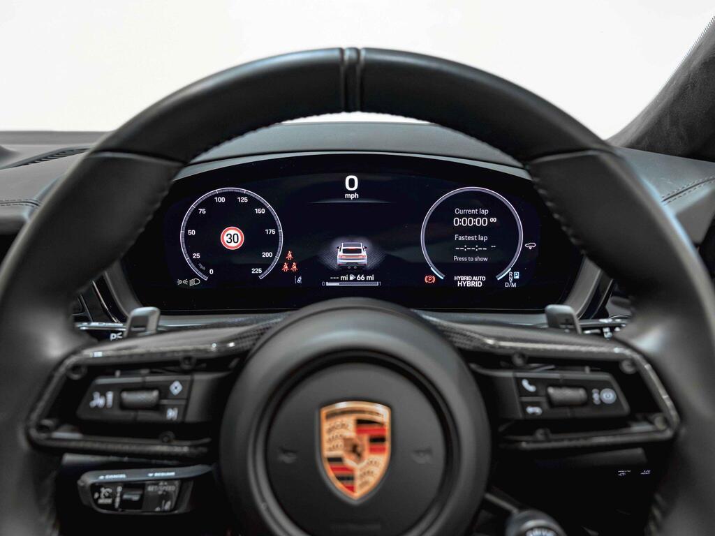 An interior shot of the steering wheel on a 2024 Porsche Cayenne