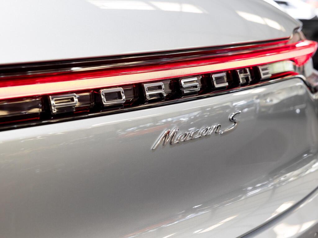 An exterior shot of the badge exterior on a 2025 Porsche Macan