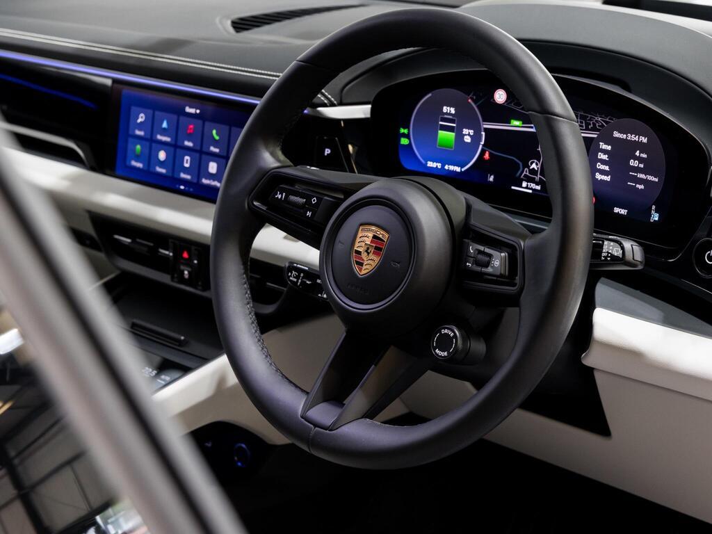 An interior shot of the steering wheel on a 2025 Porsche Macan