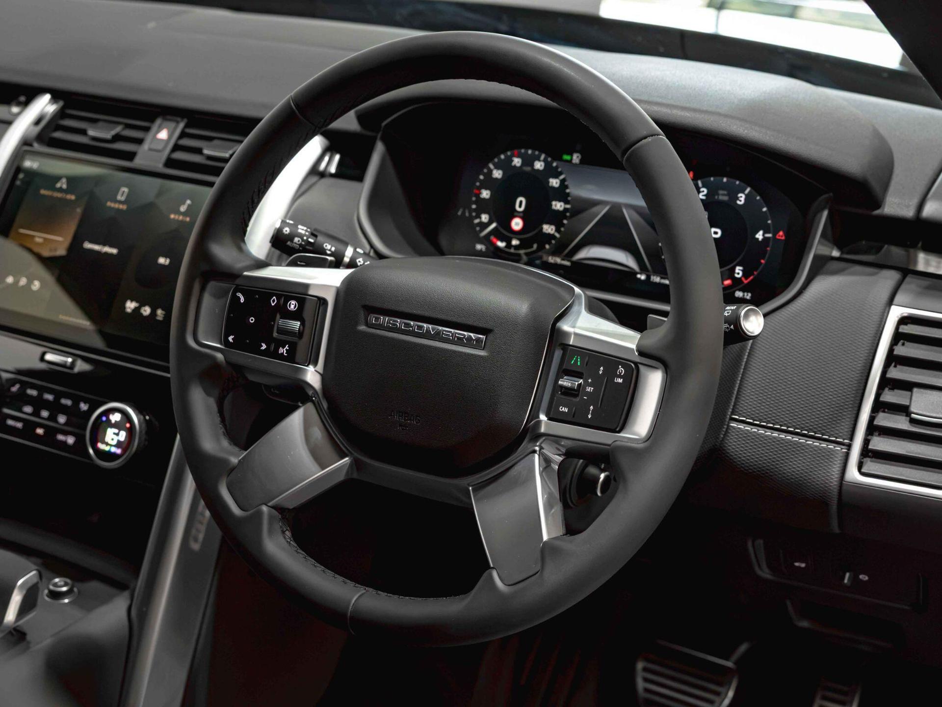 An interior shot of the steering wheel on a 2025 Land Rover Discovery