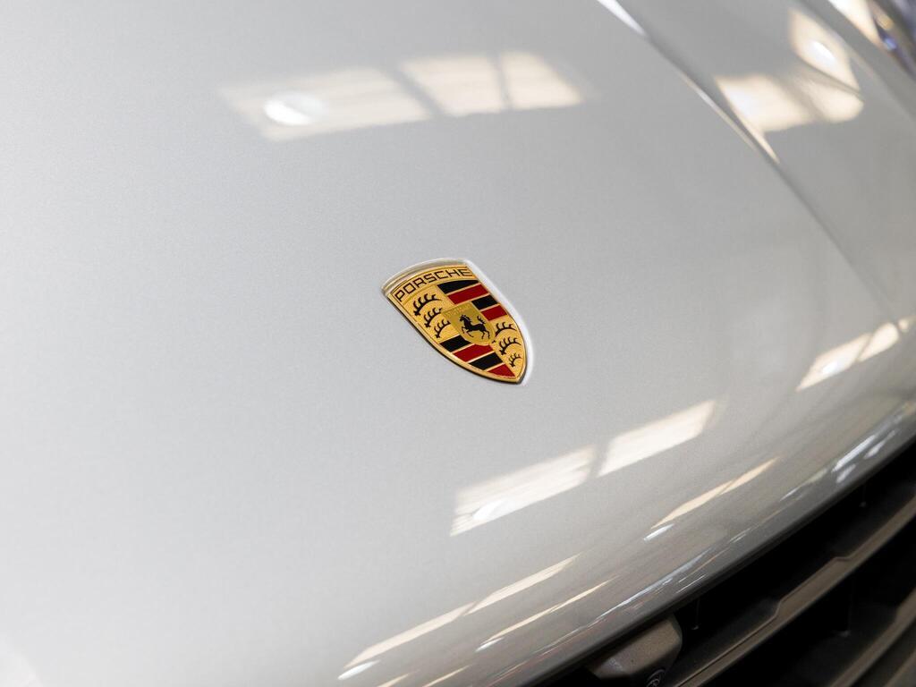 An exterior shot of the badge exterior on a 2025 Porsche Macan