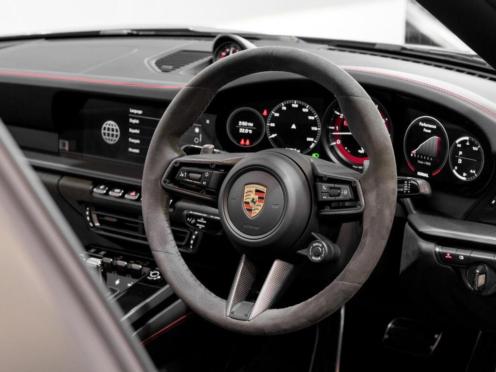 An interior shot of the steering wheel on a 2023 Porsche 911