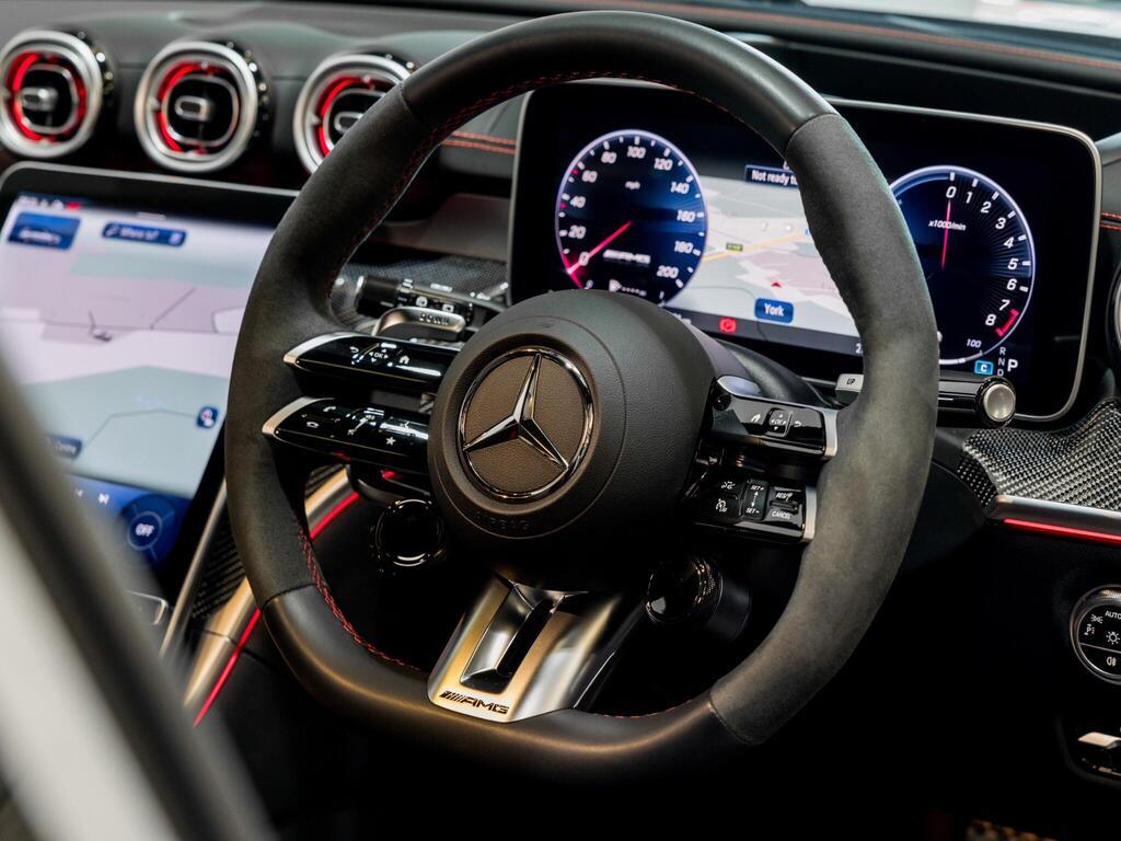 An interior shot of the steering wheel on a 2024 Mercedes-Benz C Class