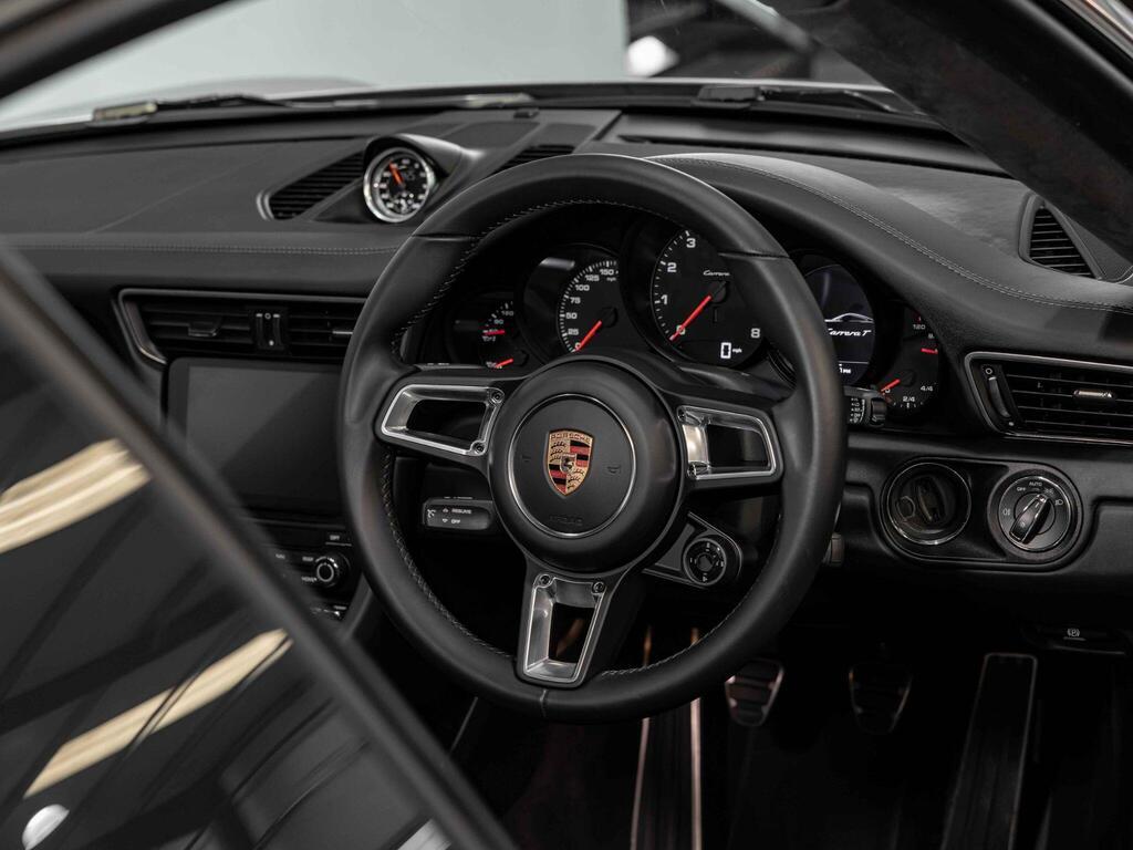 An interior shot of the steering wheel on a 2018 Porsche 911