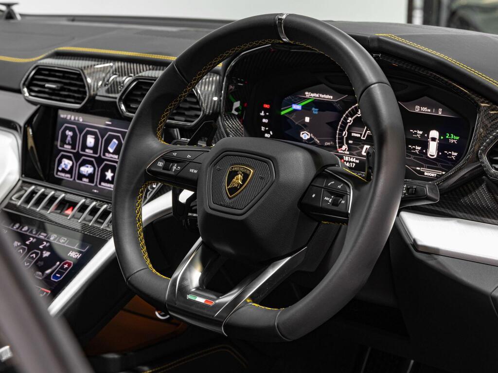 An interior shot of the steering wheel on a 2022 Lamborghini Urus