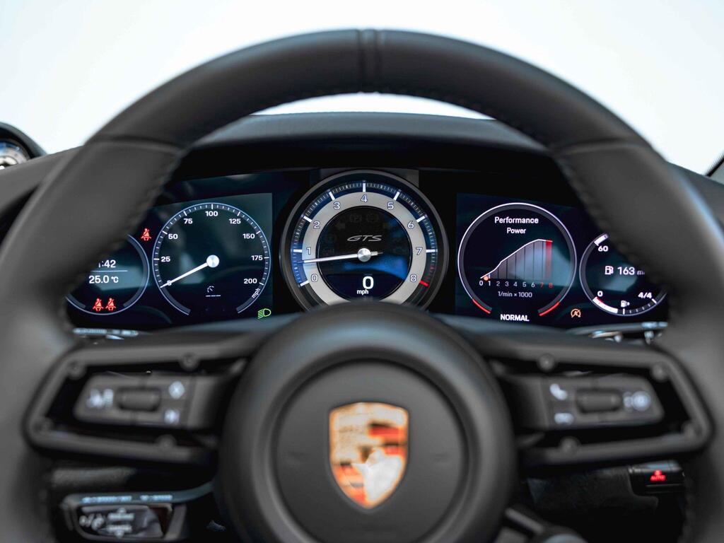 An interior shot of the steering wheel on a 2021 Porsche 911
