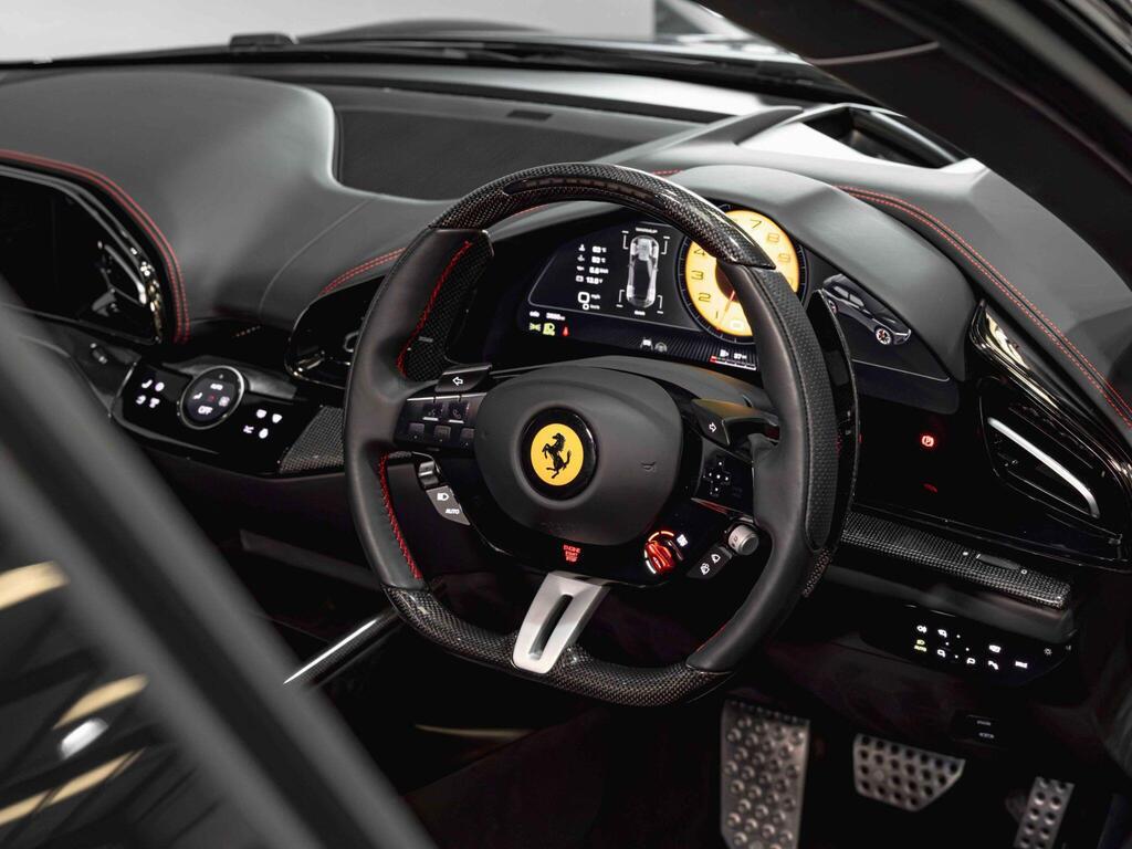 An interior shot of the steering wheel on a 2024 Ferrari Purosangue