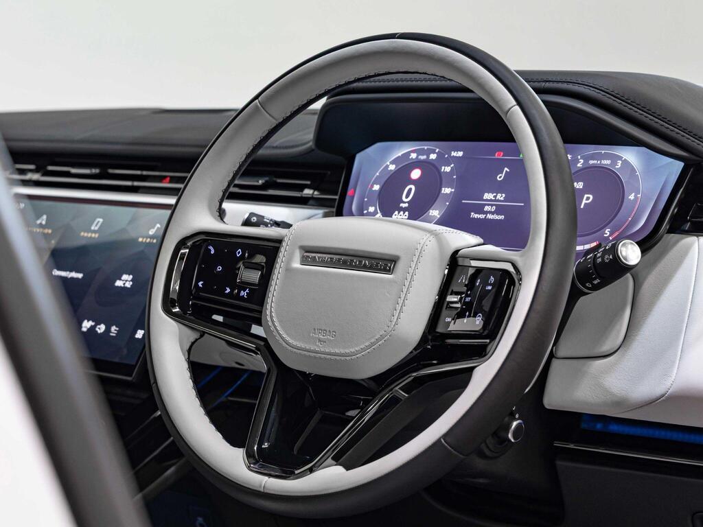 An interior shot of the steering wheel on a 2023 Land Rover RANGE ROVER SPORT
