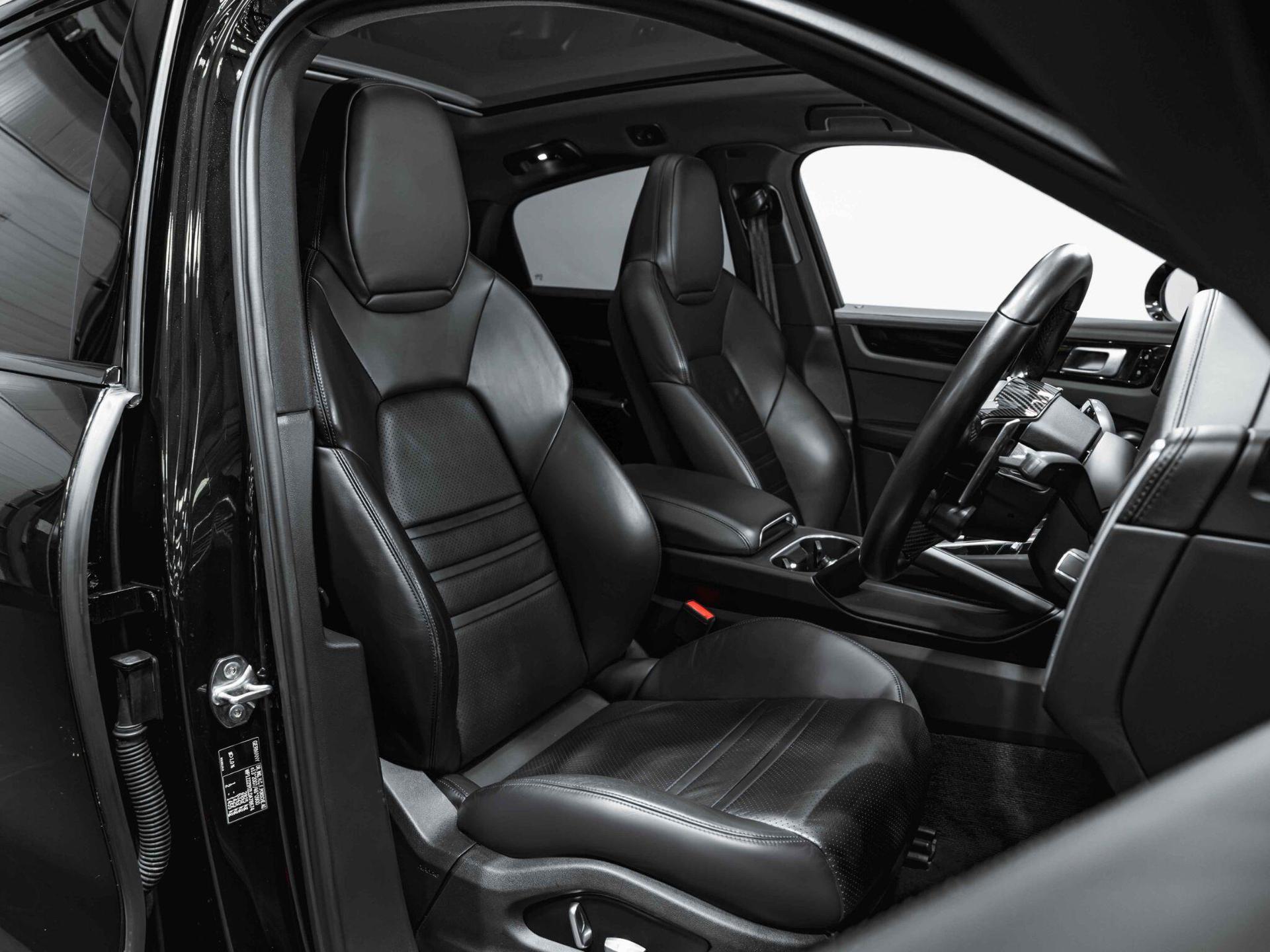 An interior shot of the driver seat on a 2019 Porsche Cayenne