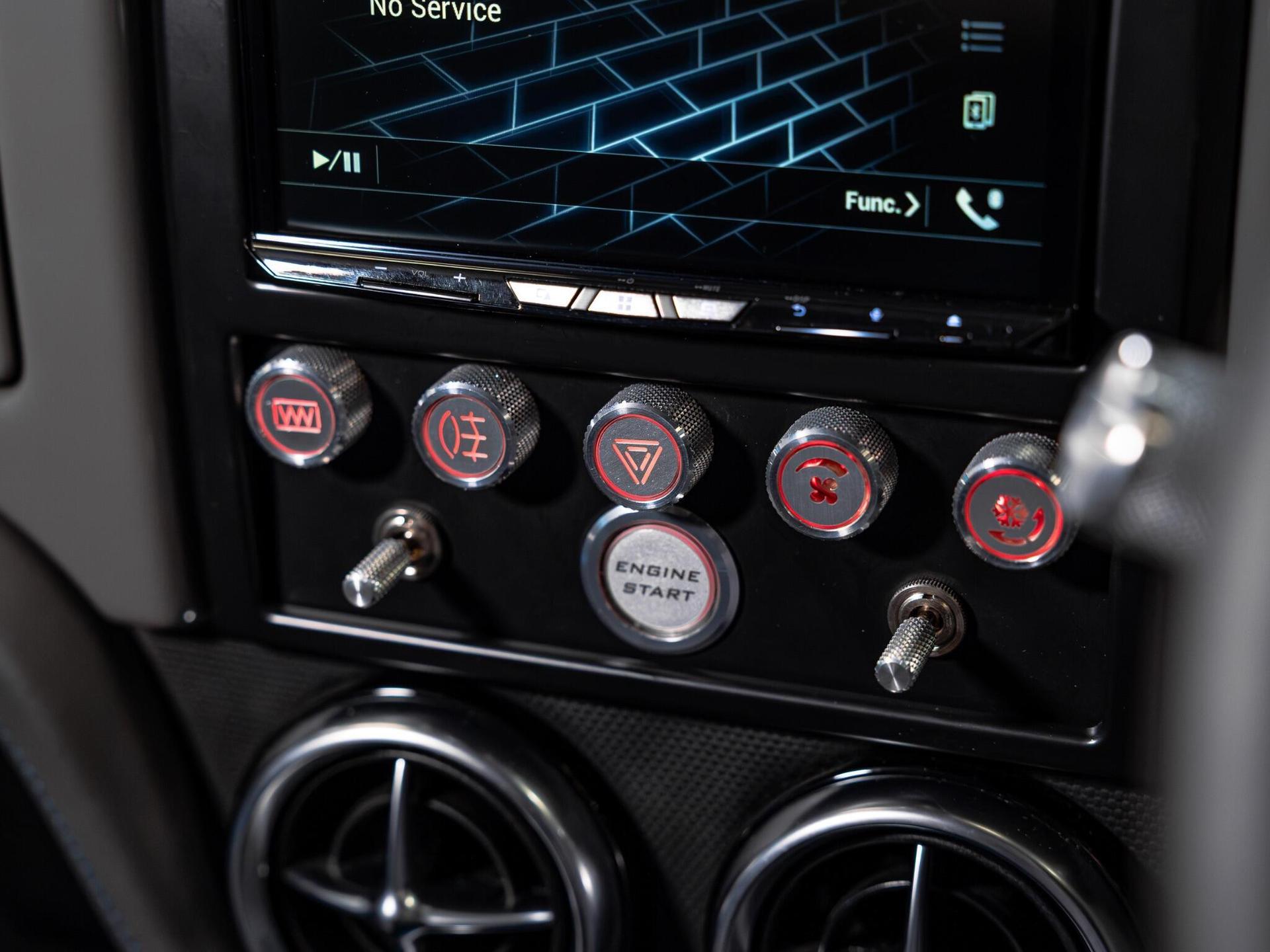 An interior shot of the infotainment system on a 1997 Rover Mini