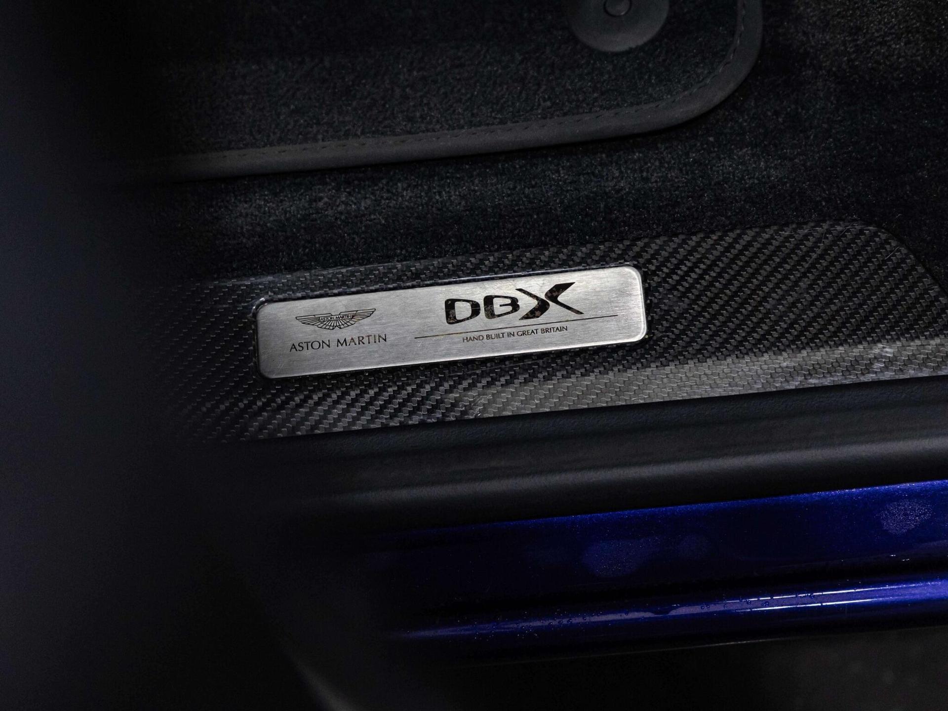 An exterior shot of the badge exterior on a 2023 Aston Martin DBX