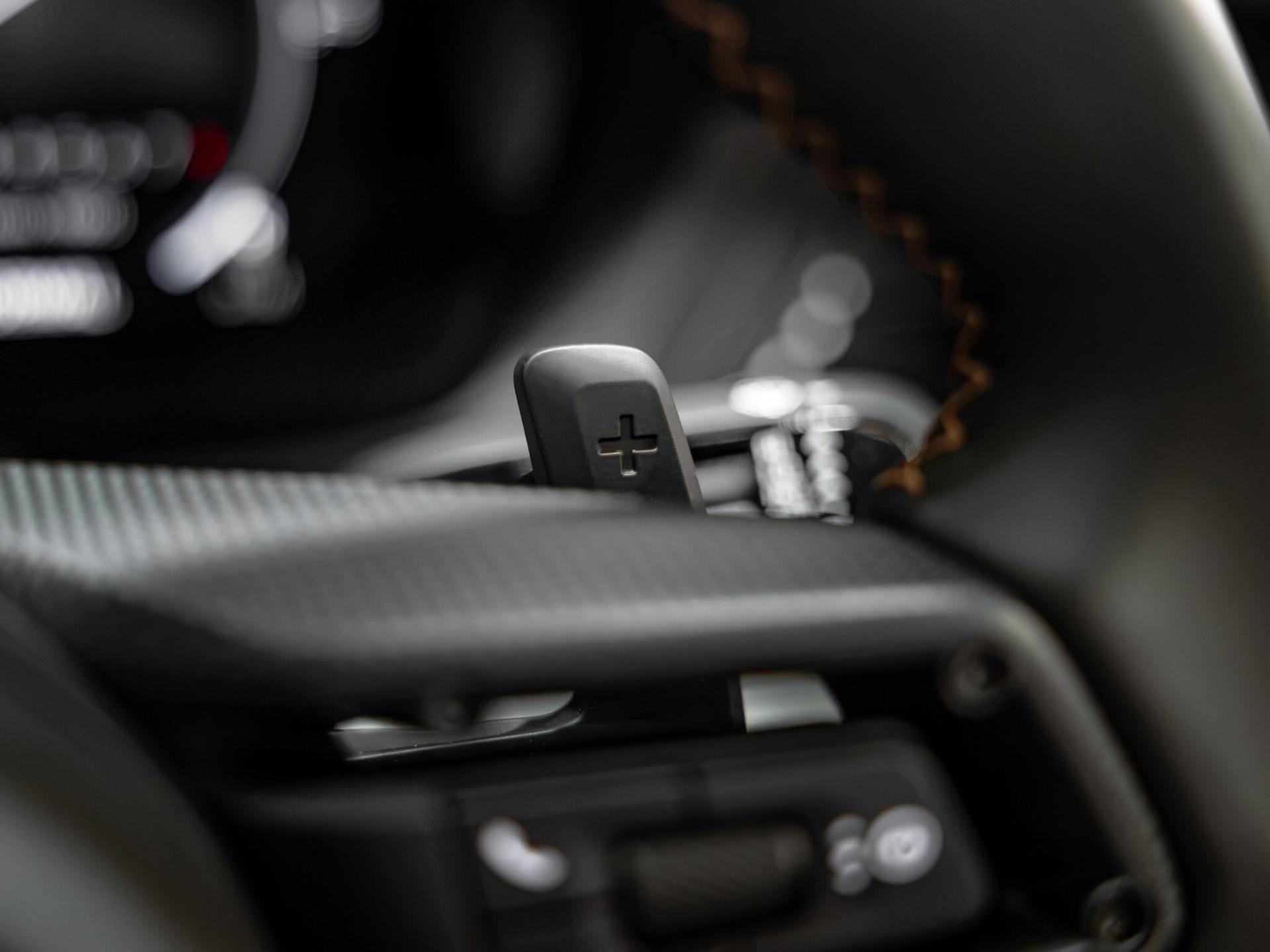 An interior shot of the steering wheel on a 2026 Porsche 911