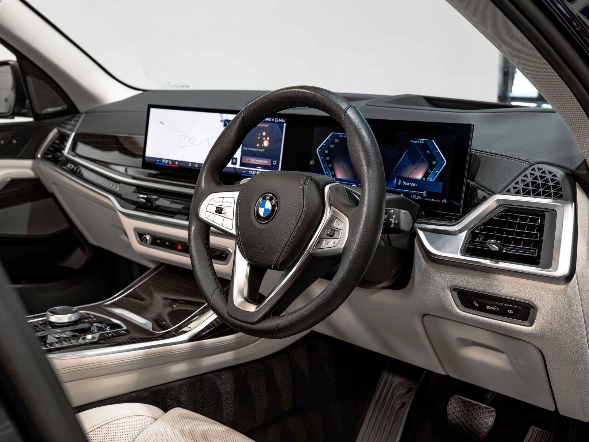 An interior shot of the steering wheel on a 2024 BMW X7