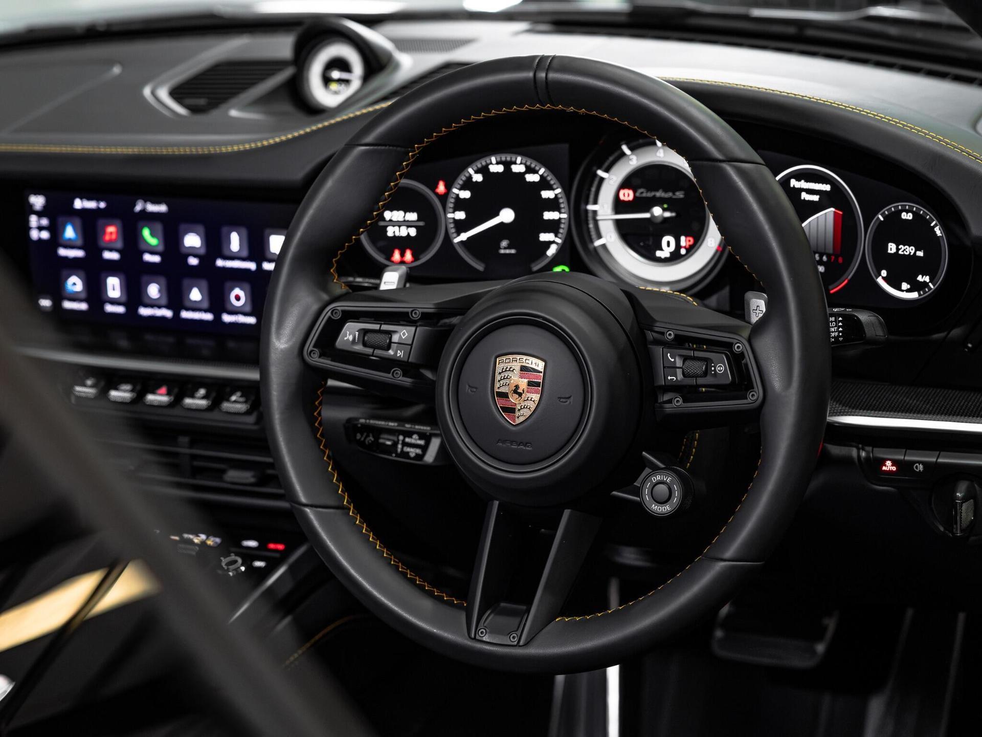 An interior shot of the steering wheel on a 2022 Porsche 911