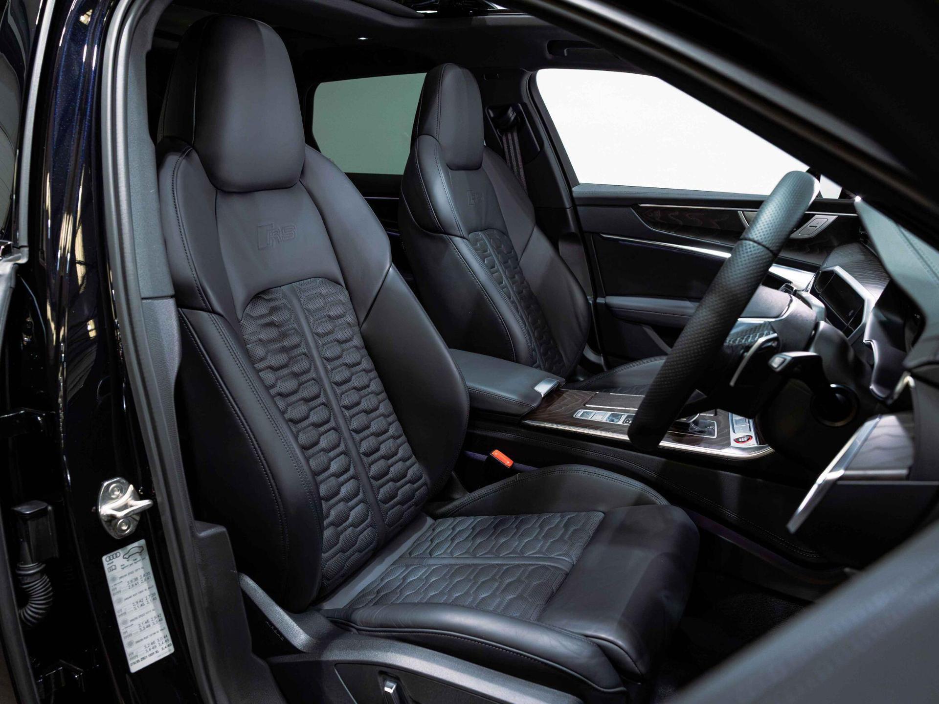 An interior shot of the driver seat on a 2023 Audi RS6 Avant