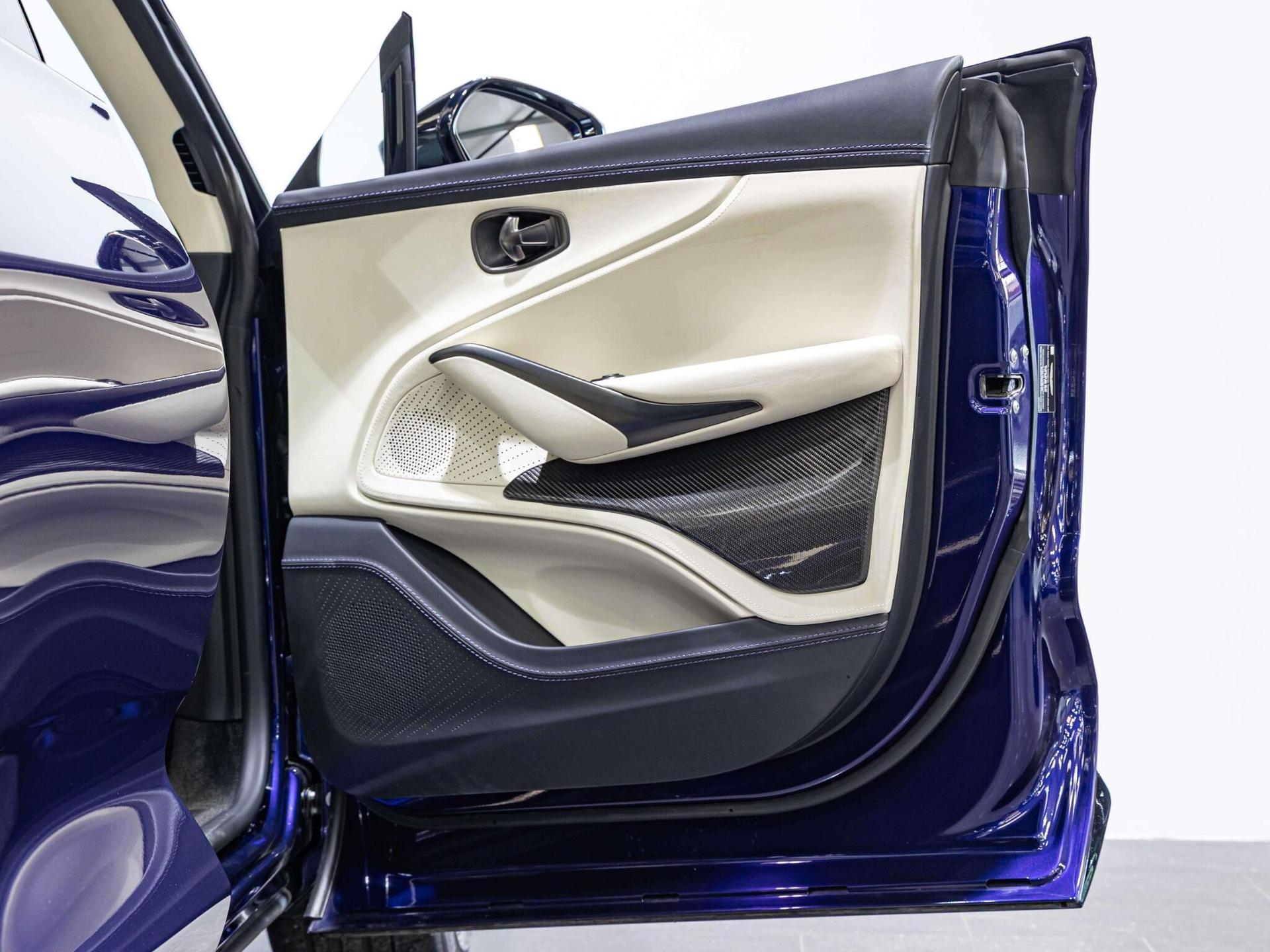 An interior shot of the door interior on a 2023 Aston Martin DBX