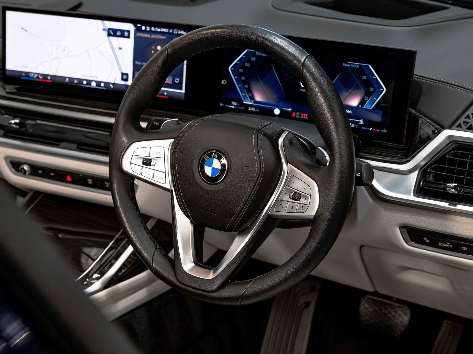 An interior shot of the steering wheel on a 2024 BMW X7