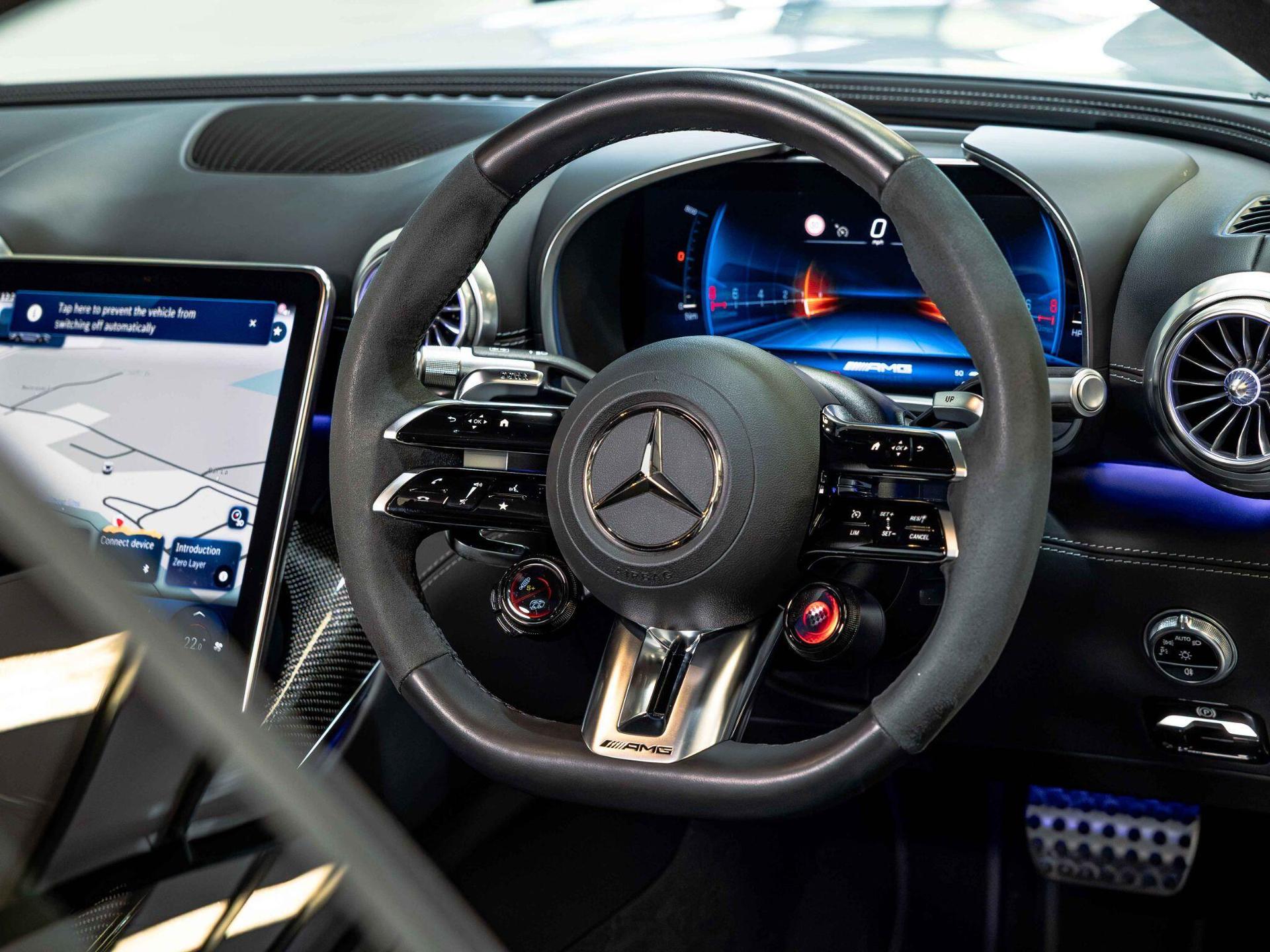 An interior shot of the steering wheel on a 2024 Mercedes-Benz AMG GT