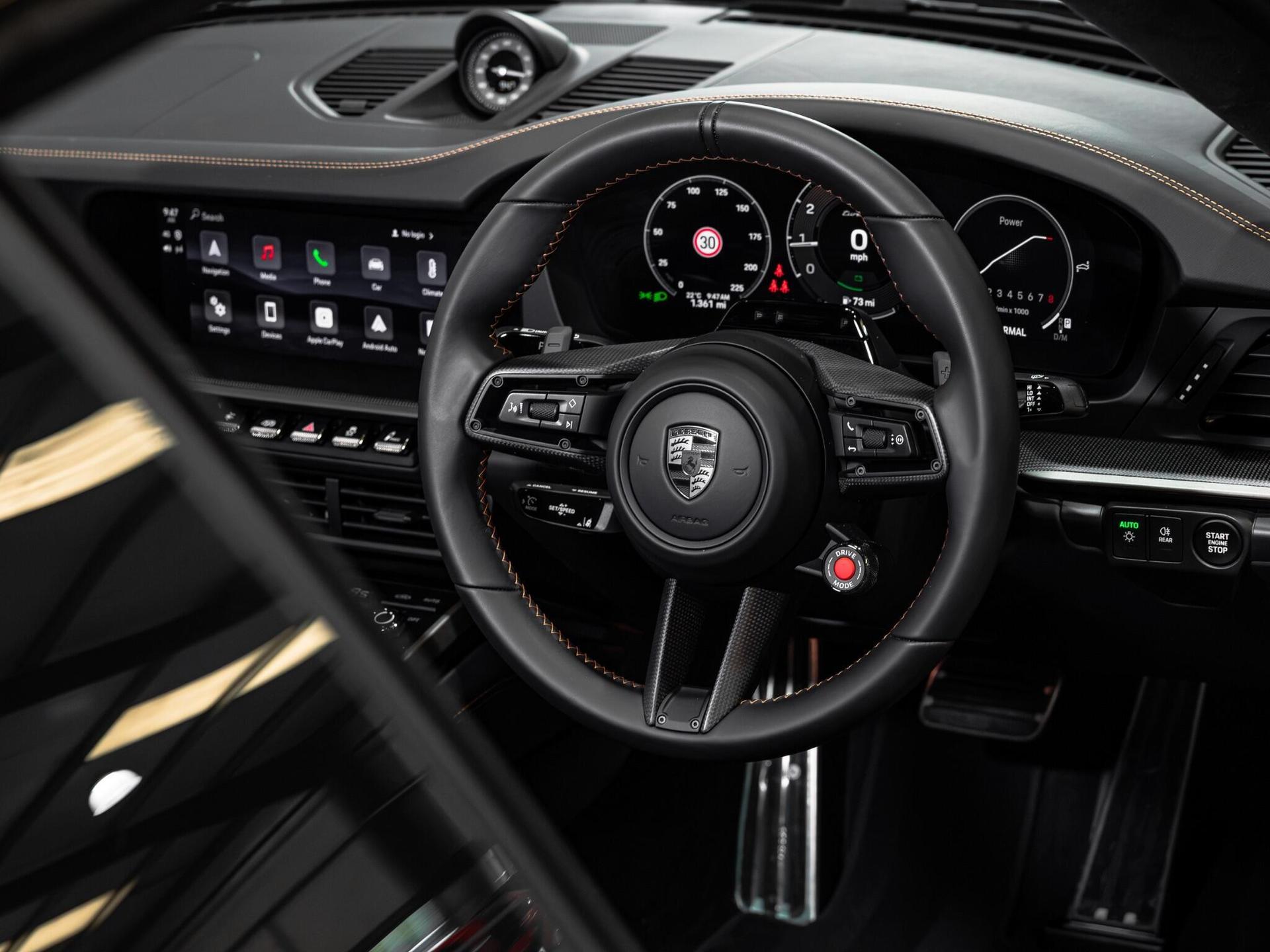 An interior shot of the steering wheel on a 2026 Porsche 911