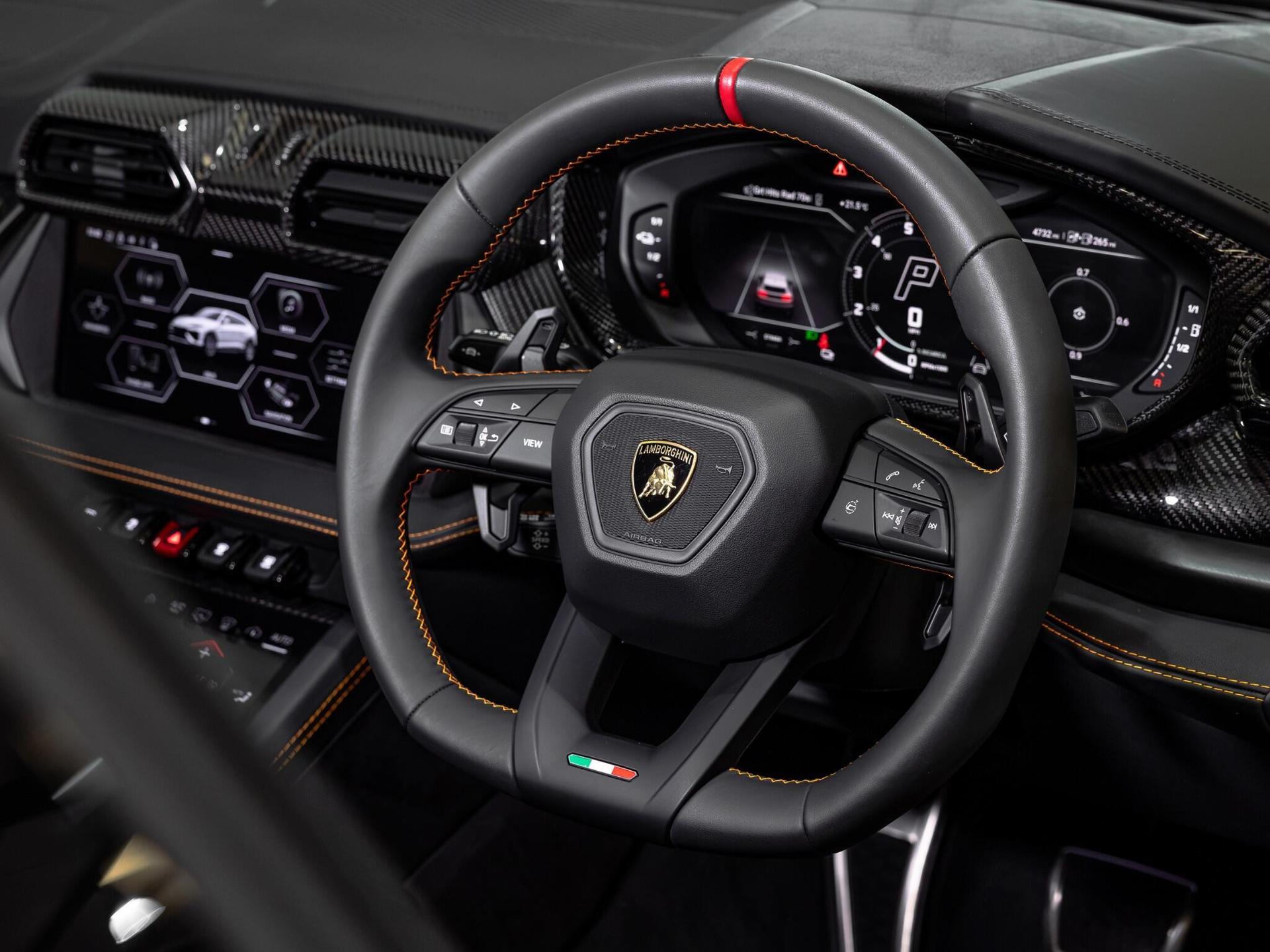 An interior shot of the steering wheel on a 2025 Lamborghini Urus