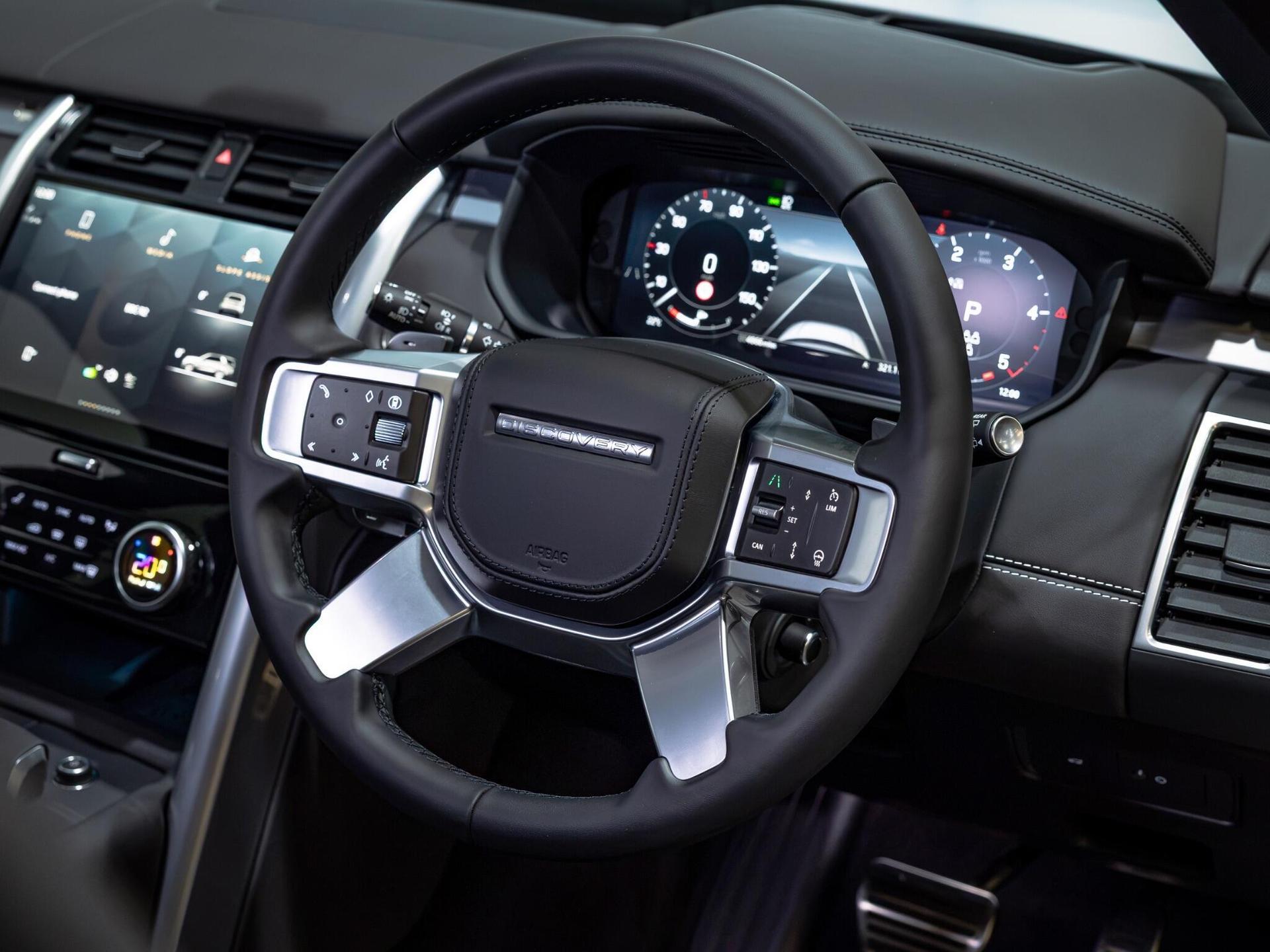 An interior shot of the steering wheel on a 2026 Land Rover Discovery