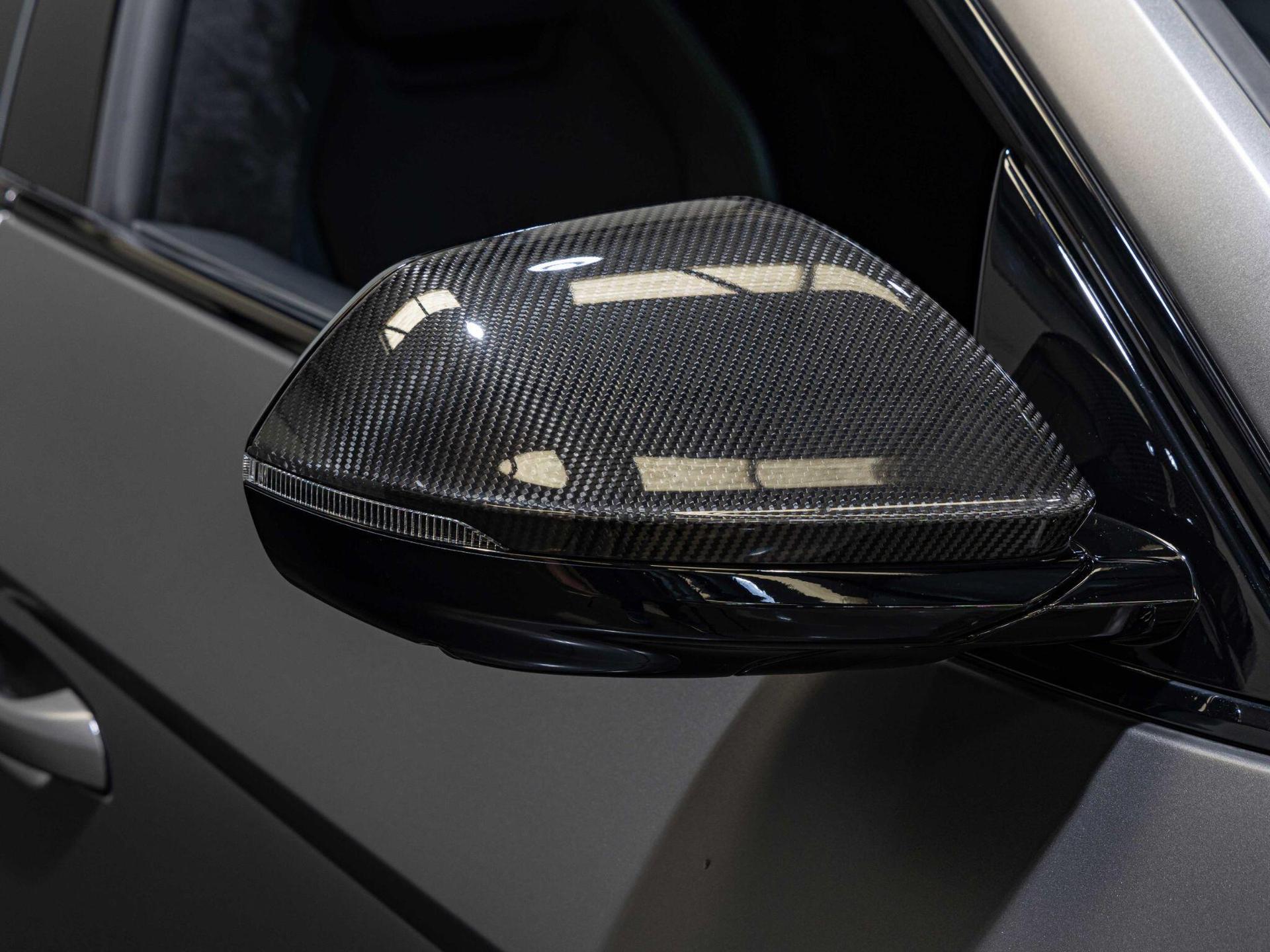 An exterior shot of the wing mirror on a 2022 Lamborghini Urus