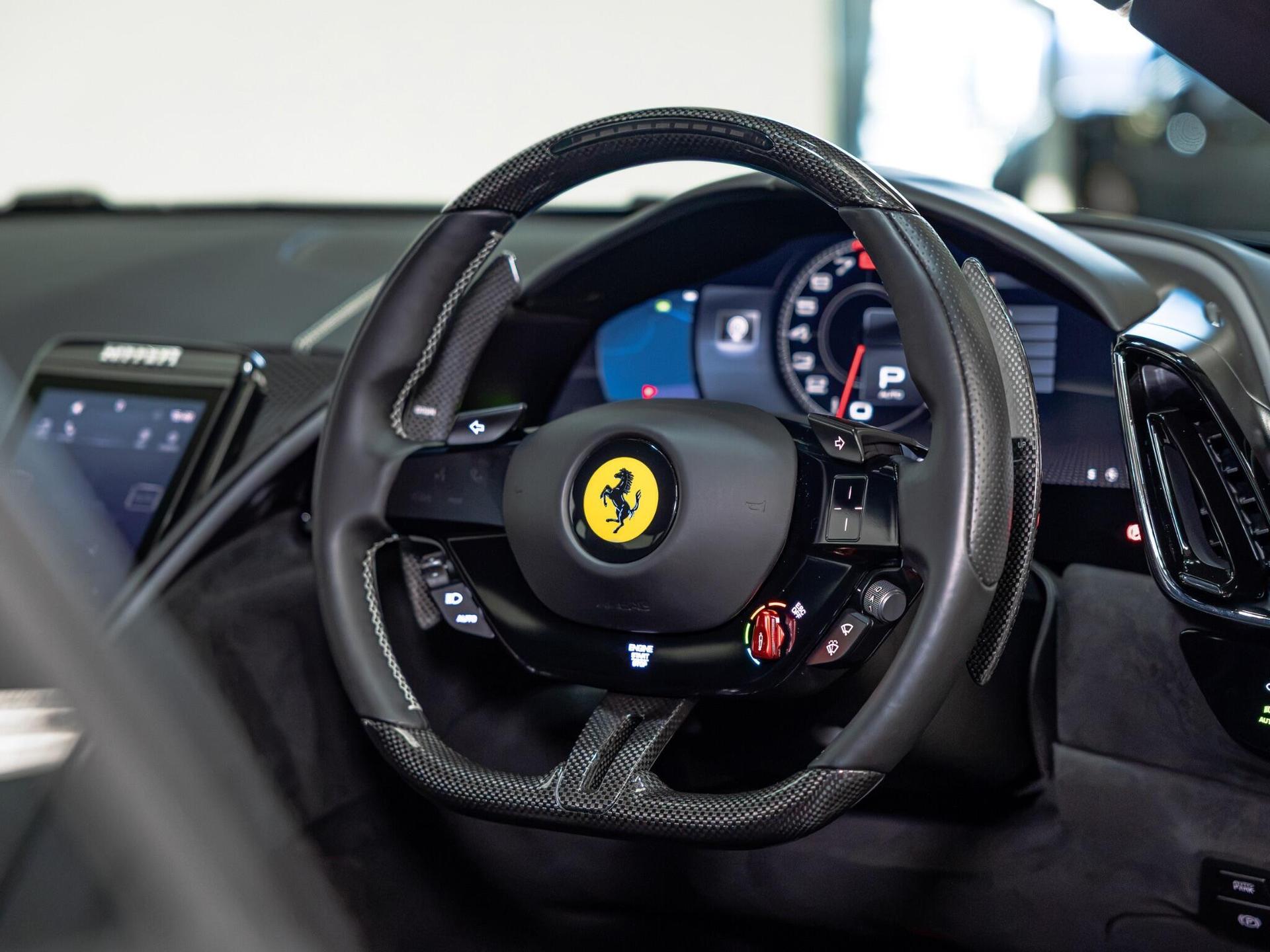 An interior shot of the steering wheel on a 2022 Ferrari Roma