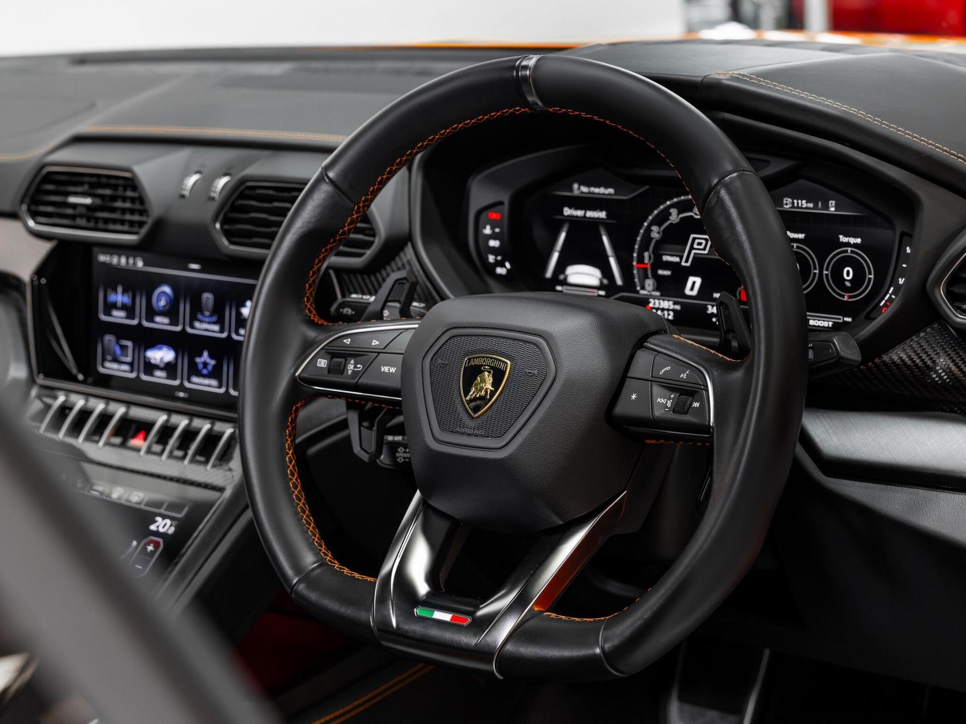 An interior shot of the steering wheel on a 2023 Lamborghini Urus