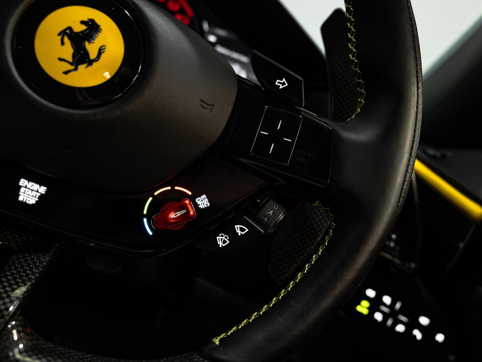 An interior shot of the steering wheel on a 2021 Ferrari Roma