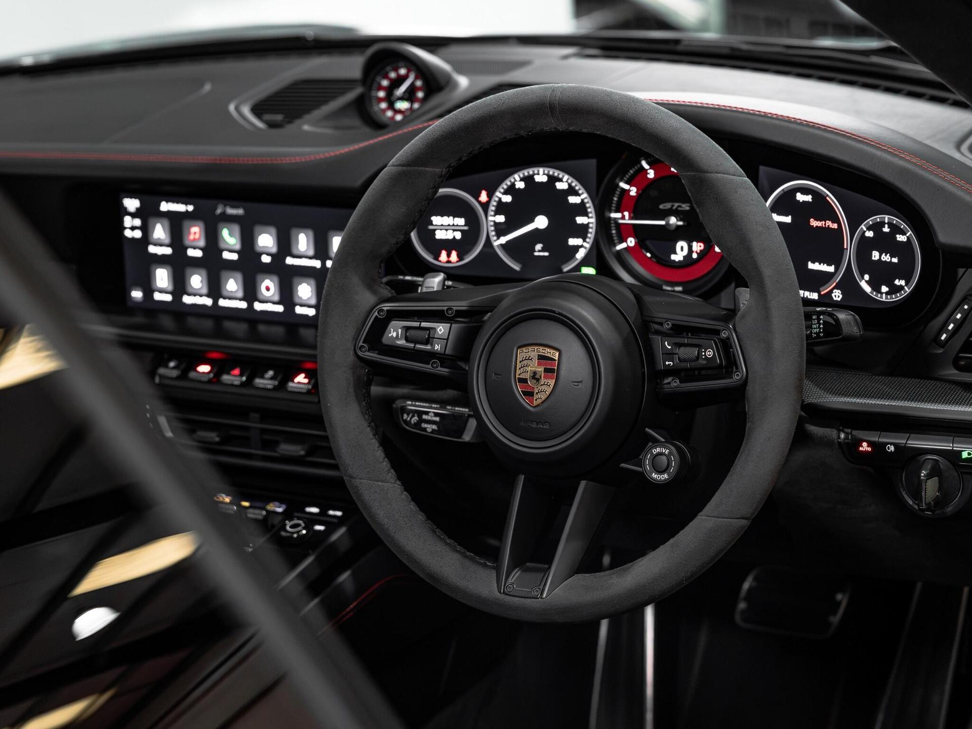An interior shot of the steering wheel on a 2021 Porsche 911
