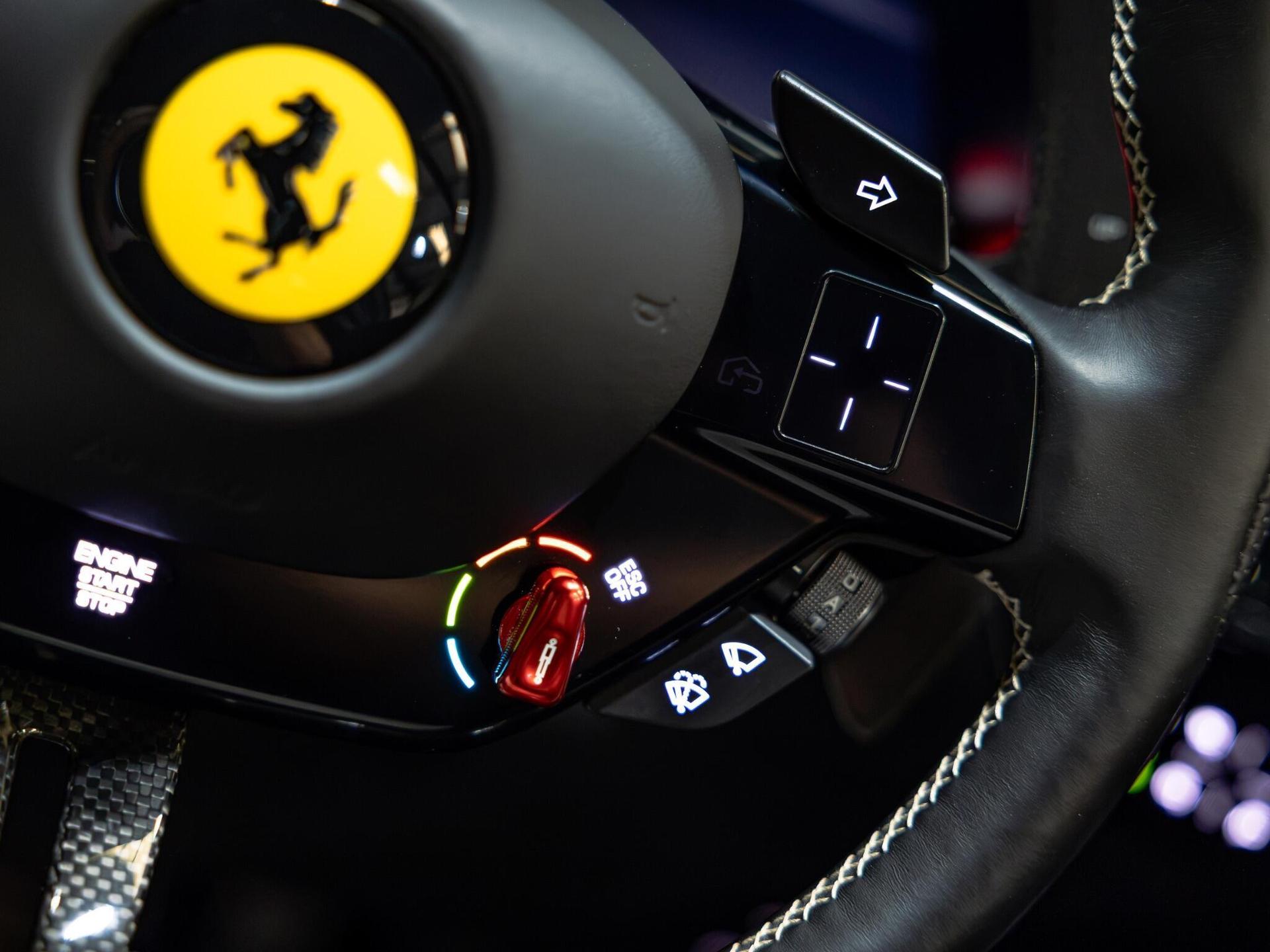 An interior shot of the steering wheel on a 2022 Ferrari Roma