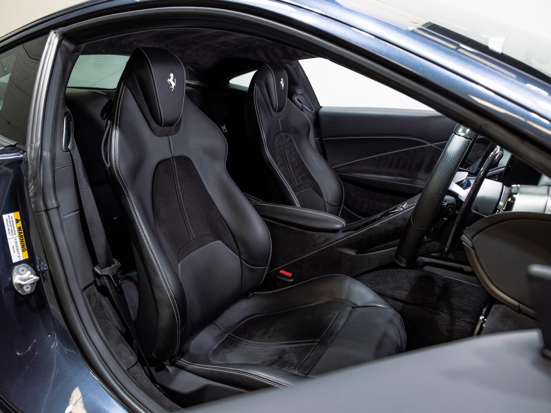 An interior shot of the driver seat on a 2022 Ferrari Roma